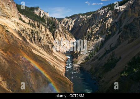 WYOMING - Rainbow from rim of Lower Falls of the Yellowstone River in Grand Canyon of the Yellowstone; Yellowstone National Park Stock Photo