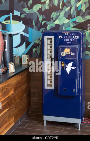 An old coke dispenser converted for coffee at the trendy Pure Black espresso bar in the hip Wicker Park neighborhood in the West Town community in Chicago, Illinois, USA Stock Photo