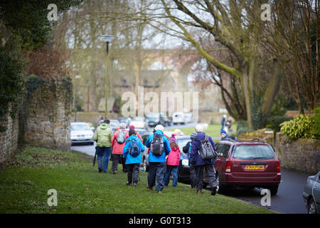 Whalley a large village in Ribble Valley on the banks of the River Calder in Lancashire.  Ramblers set off wether rain waterproo Stock Photo