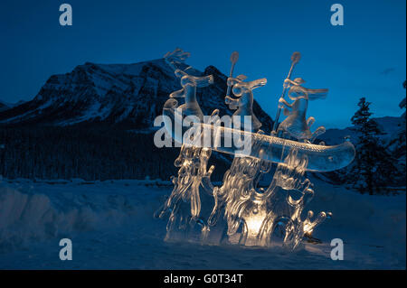 Ice sculpture of indigenous people in a canoe, Lake Louise, Banff National Park, Alberta, Canada Stock Photo