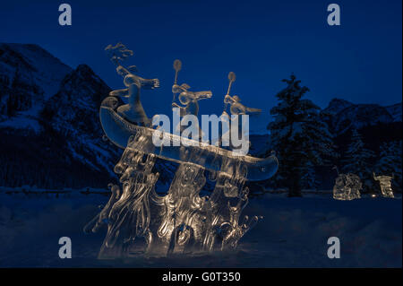 Ice sculpture of indigenous people in a canoe, Lake Louise, Banff National Park, Alberta, Canada Stock Photo