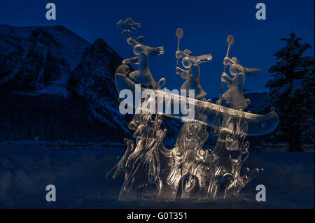 Ice sculpture of indigenous people in a canoe, Lake Louise, Banff National Park, Alberta, Canada Stock Photo