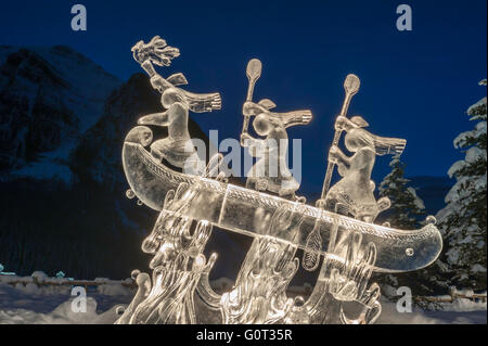 Ice sculpture of indigenous people in a canoe, Lake Louise, Banff National Park, Alberta, Canada Stock Photo