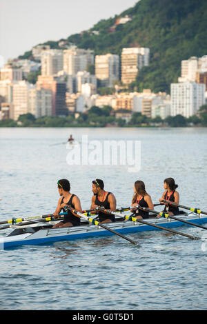 RIO DE JANEIRO - APRIL 2, 2016: A quadruple scull boat (with four rowers) prepares to compete in a race at Lagoa. Stock Photo