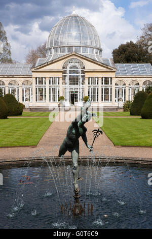 Syon House Great Conservatory with glass dome (Grade I listed building) and statue of winged Mercury and formal garden pond. UK Stock Photo