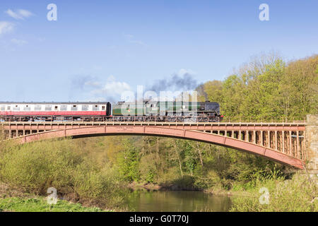 Steam train crossing the River Severn at Victoria Bridge on the Severn Valley Railway at Arley, Worcestershire, England, UK Stock Photo