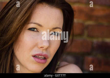 Portrait of a Worried Thoughtful Woman Outside Looking At The Camera Stock Photo
