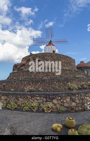Windmill on top of a spiral path at the Lanzarote Cactus Garden. Designed by César Manrique. Stock Photo
