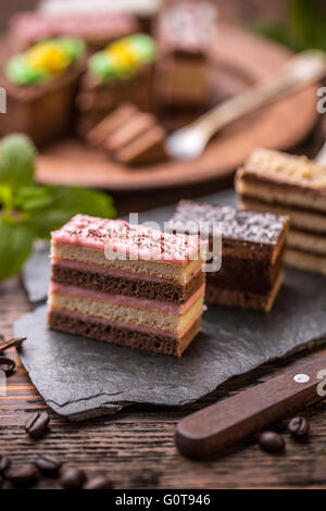 Assorted different mini cakes with cream Stock Photo