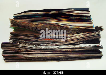 Stack of old magazines spoiled close up Stock Photo