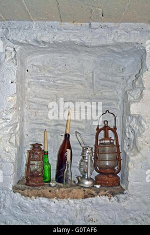 Old rusty oil lamps and candles, still life photography Stock Photo