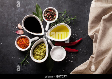 Herbs, condiments and spices on stone background. Top view Stock Photo
