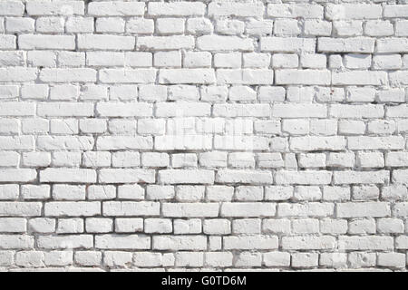 Brick wall painted with white paint Stock Photo