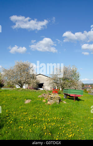 Barn with a trailer infront Stock Photo
