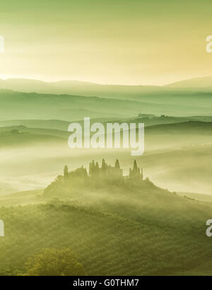 Mist at Podere Belvedere in Val d'Orcia by sunrise, Tuscany, Italy.