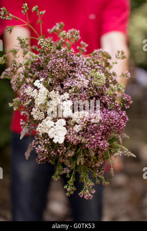 Man holding bouquet of flowers Stock Photo