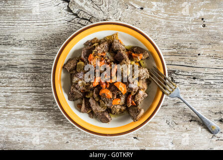 Plate of fried pork liver Stock Photo