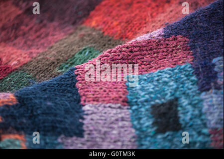 Hand knitted jumper detail showing patchwork block effect Stock Photo