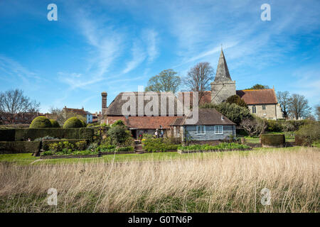 The Clergy House and St. Andrew's Church at Alfriston, East Sussex, UK Stock Photo