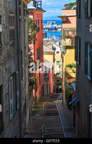 Narrow steep alley in the city center of Genoa Stock Photo