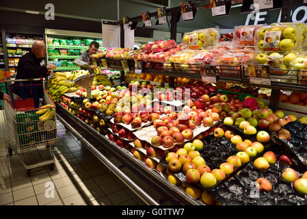 Fruit counter in supermarket with variety of apples Stock Photo