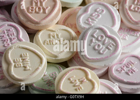 Close up macro shot of a pile of love heart sweets Stock Photo