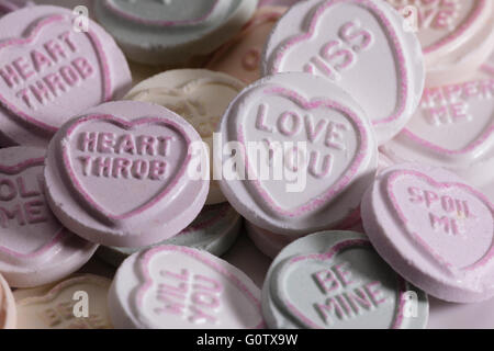 Close up macro shot of a pile of love heart sweets Stock Photo