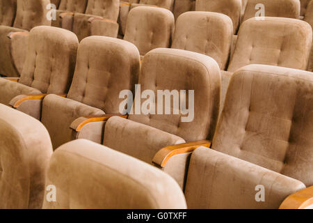 Empty brown velvet cinema seats Stock Photo