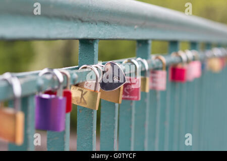 heart shaped padlock on bridge - love symbol Stock Photo