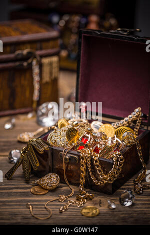 Open treasure chest full of jewellery Stock Photo