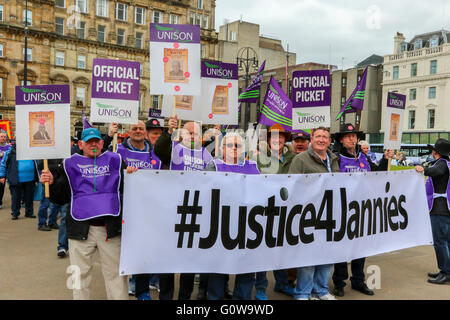 Glasgow, Scotland, UK. 4th May, 2016. Glasgow School Janitors (Jannies) took industrial action for the third time since 19 January 2016 in a dispute involving supplementary payments for undertaking duties which are considered 'Dirty' or working 'outwith a regular basis'. The 'Jannies' took their protest to Glasgow City Council by parading in a good natured manner around George Square and blockading the City Chambers to highlight their dispute. Credit:  Findlay/Alamy Live News Stock Photo