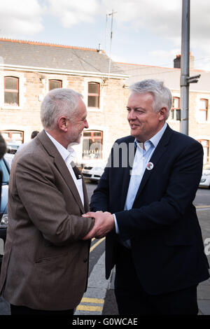 Maesteg, Wales, UK. 4th May 2016. On the eve of the Welsh Assembly election, Labour leader Jeremy Corbyn and First Minister of Wales Carwyn Jones visit Maesteg, which will also hold a Westminster by-election for the Ogmore constituency tomorrow.  Pictured: Jeremy Corbyn (L) is greeted by Carwyn Jones (R) as he arrives in Maesteg. Credit:  Polly Thomas/Alamy Live News Stock Photo