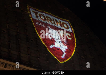 On 4 may, the 67 anniversary of the Superga air disaster, where players of the 'Grande Torino' lost their lives in a plane crash, the symbol of Turin, the Mole Antonelliana is lighted with red-Garnet and the main façade is projected the team's symbol (Photo by: Daniela Parra Saiani/Pacific Press) Stock Photo