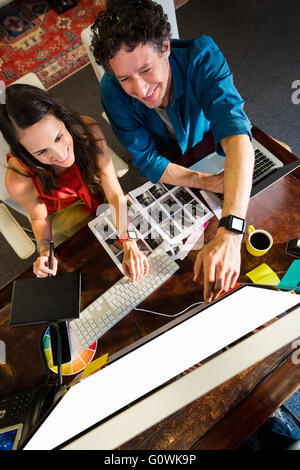 Colleagues using a graphic pad Stock Photo