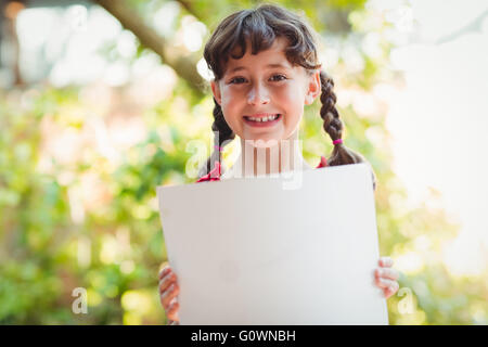 Girl holding a blank sign Stock Photo