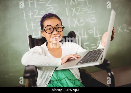 Cute girl with big glasses looking at the camera Stock Photo