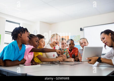 A teacher giving lesson with tablet computer