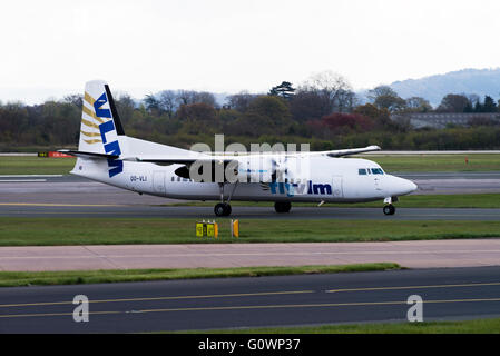 VLM Airlines Fokker 50 Turboprop Airliner OO-VLI Taxiing at Manchester International Airport England United Kingdom UK Stock Photo