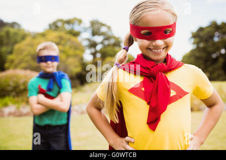 Children wearing superhero costume posing for camera Stock Photo