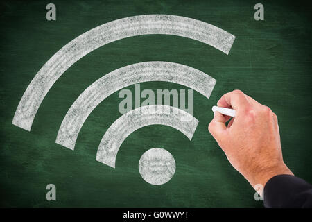Composite image of business man writing with chalk Stock Photo