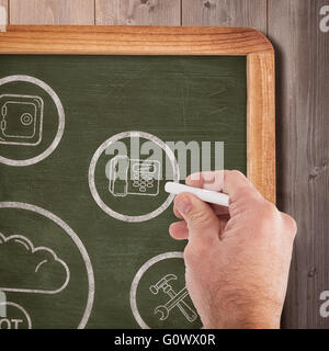 Composite image of business man writing with chalk Stock Photo