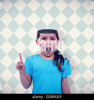 Composite image of cute girl shaking finger saying no to the camera Stock Photo