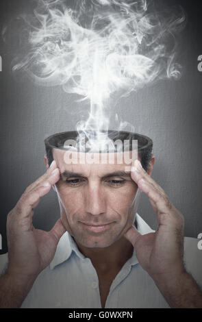 Composite image of handsome man thinking with hand on forehead Stock Photo