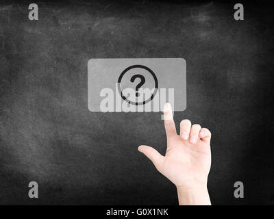 Finger tapping on an icon to symbolize a question Stock Photo