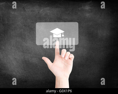 Finger tapping on an icon to symbolize education Stock Photo