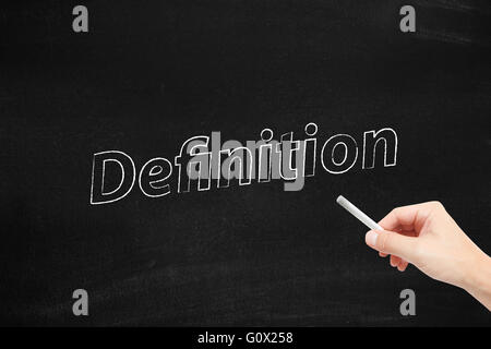 Definition written on a blackboard Stock Photo