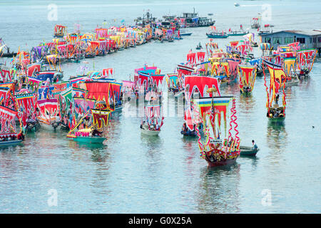 Traditional Bajau's boat called Lepa Lepa decorated with colorfull Sambulayang flag Stock Photo