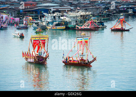 Traditional Bajau's boat called Lepa Lepa decorated with colorfull Sambulayang flag Stock Photo