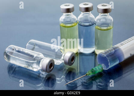 Medicine vials and syringe, conceptual image Stock Photo