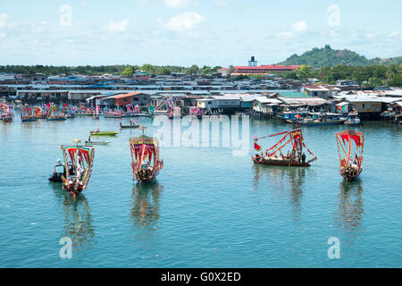 Traditional Bajau's boat called Lepa Lepa decorated with colorfull Sambulayang flag Stock Photo